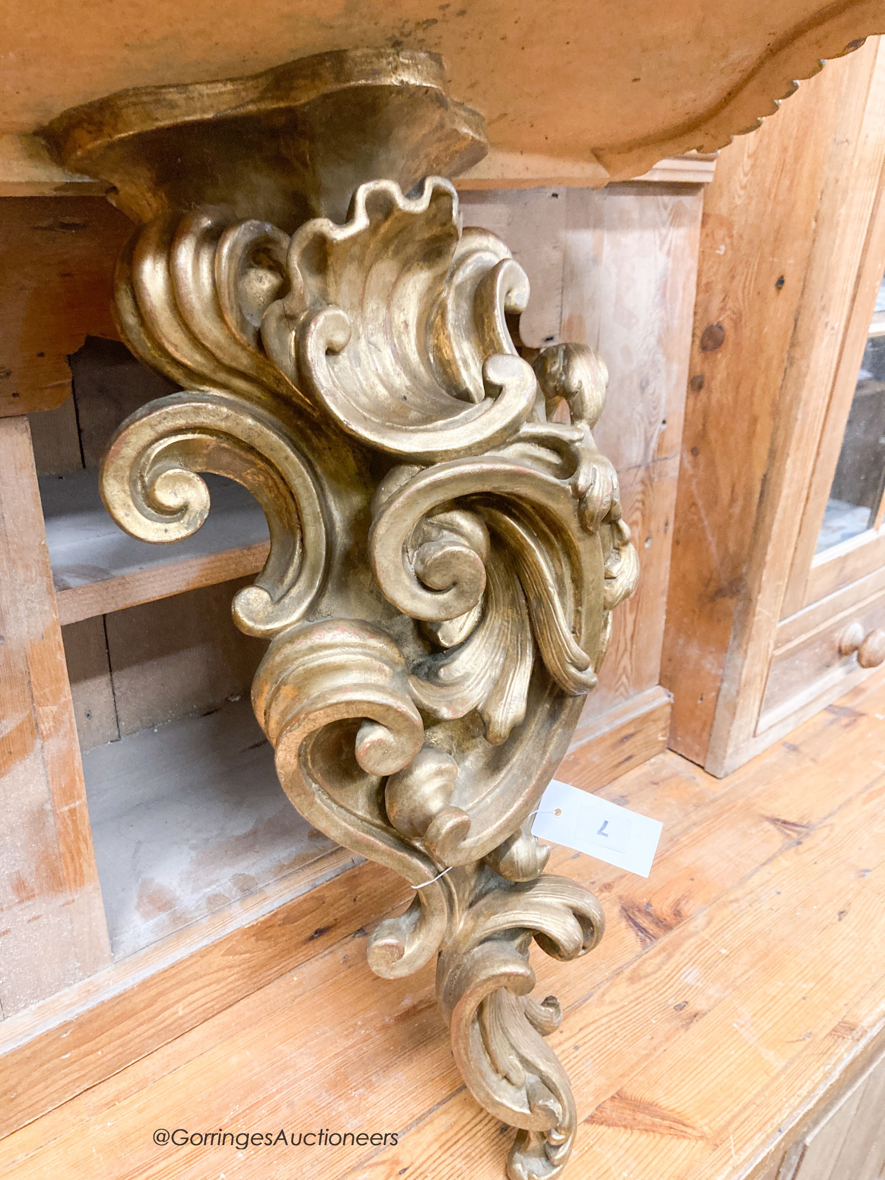 An Italian carved pine gilt console table, width 66cm, depth 38cm, height 67cm